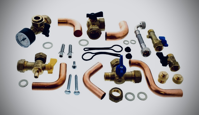 Boiler repair parts on a Dales Boiler Services engineer van — valves, pump, PCB and pressure gauge